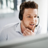 Shot of a handsome young man working in a call center
