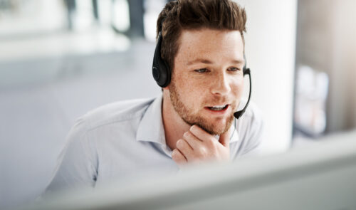 Shot of a handsome young man working in a call center