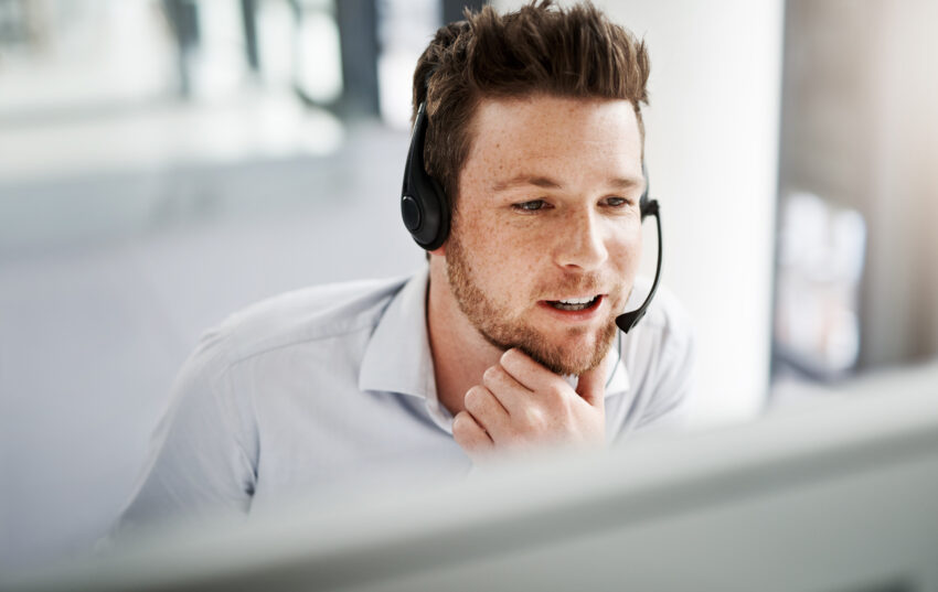 Shot of a handsome young man working in a call center